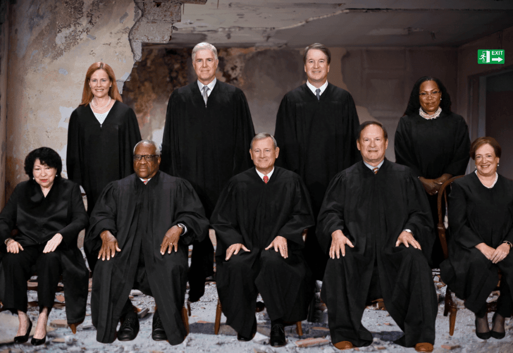 Group of judges in robes posing together.